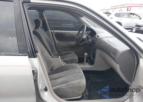 2001 Toyota Corolla Le z USA, uszkodzony, nr VIN 2T1BR12EX1C486482